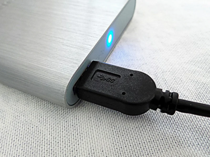 An external hard drive connected to a laptop for local backup storage
