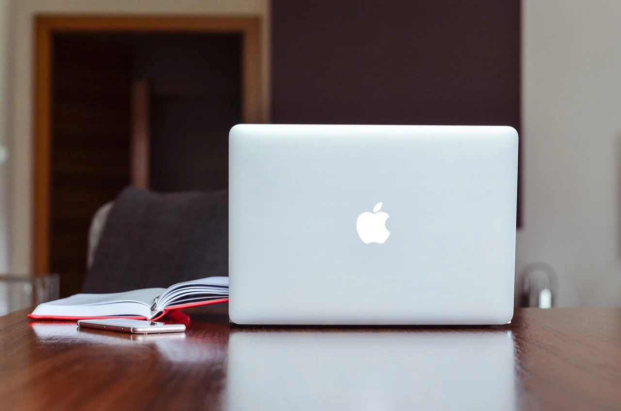 laptop on a desk with WordPress backup plugin dashboard open
